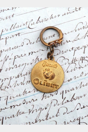 Oude Franse vintage sleutelhanger "Biscuits Olibet"