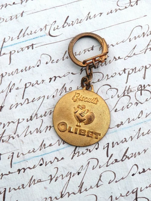 Oude Franse vintage sleutelhanger "Biscuits Olibet"